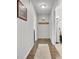 Entryway with hardwood floors, light gray walls, a patterned rug, coat rack and decorative artwork at 108 Gambels Ln, Summerville, SC 29485