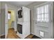 Convenient laundry area with stacked washer and dryer, plus easy backyard access at 108 Gambels Ln, Summerville, SC 29485