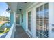 Outdoor balcony showcasing wood floors, white railings, and a view of the nearby pond at 1089 Fort Johnson Rd, Charleston, SC 29412