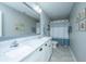 Modern bathroom featuring a double sink vanity with marble countertops and a separate shower area at 1089 Fort Johnson Rd, Charleston, SC 29412