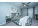 Comfortable bedroom featuring a queen-size bed with stylish bedding, a ceiling fan, and modern decor at 1089 Fort Johnson Rd, Charleston, SC 29412