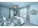 Bedroom with a queen-size bed, stylish bedding, a ceiling fan, and access to an outdoor balcony at 1089 Fort Johnson Rd, Charleston, SC 29412