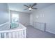 Well-lit Bedroom with a white crib, dresser, and neutral décor at 1089 Fort Johnson Rd, Charleston, SC 29412