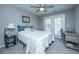 Cozy bedroom with a comfortable bed, a ceiling fan, and a door leading to an outdoor space at 1089 Fort Johnson Rd, Charleston, SC 29412