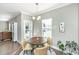 Bright breakfast nook features a modern light fixture, round table, and views of the outdoors at 1089 Fort Johnson Rd, Charleston, SC 29412