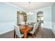 Formal dining area boasts wainscoting, modern light fixture and adjacent spaces for easy entertaining at 1089 Fort Johnson Rd, Charleston, SC 29412