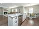 Open kitchen with an island, a dining area, and stainless steel appliances, perfect for entertaining guests at 1089 Fort Johnson Rd, Charleston, SC 29412