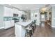 Modern kitchen with white cabinets, a center island with seating, and stainless steel appliances at 1089 Fort Johnson Rd, Charleston, SC 29412