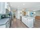 Bright, open kitchen featuring stainless appliances, gas range, light countertops and backsplash, plus ample cabinet space at 1089 Fort Johnson Rd, Charleston, SC 29412