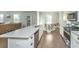 Open kitchen design boasts a breakfast nook, stainless steel appliances, light countertops, and seamless flow to living spaces at 1089 Fort Johnson Rd, Charleston, SC 29412