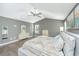 Expansive main bedroom with tray ceilings, dual windows, and light gray wall coloring at 1089 Fort Johnson Rd, Charleston, SC 29412