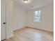 Clean bedroom offers neutral walls, modern floors, a window, and closet at 109 Gerideau St, Walterboro, SC 29488