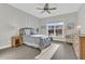 Bright bedroom featuring a ceiling fan, large window, and wood-look flooring at 116 Ivy Terrace Rd, Summerville, SC 29486