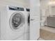 Convenient laundry room with modern washer, dryer, and adjacent bathroom at 116 Ivy Terrace Rd, Summerville, SC 29486