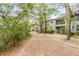 Exterior showing backyard, lush trees, and a walking path with access to the community dock at 1174 Village Creek Ln # 3, Mount Pleasant, SC 29464