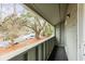 Private balcony overlooking a tranquil parking area and mature trees, offering a serene outdoor escape at 1174 Village Creek Ln # 3, Mount Pleasant, SC 29464