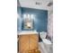 Bright bathroom with marble-topped vanity, blue accent wall and ample space offering comfort and functionality at 1174 Village Creek Ln # 3, Mount Pleasant, SC 29464