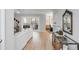 Bright living room with hardwood floors, access to the balcony, and view of the dining area at 1174 Village Creek Ln # 3, Mount Pleasant, SC 29464