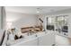 Cozy living room with white sectional, ceiling fan, and sliding glass doors to a private balcony at 1174 Village Creek Ln # 3, Mount Pleasant, SC 29464