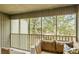 Relax on the screened porch, overlooking the lush greenery and providing a peaceful outdoor retreat at 1174 Village Creek Ln # 3, Mount Pleasant, SC 29464