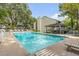 Resort-style community pool with clear blue water, lounge chairs, and shaded gazebo at 1174 Village Creek Ln # 3, Mount Pleasant, SC 29464