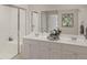 Bathroom featuring double vanity with marble counters, shower with glass doors, and contemporary design elements at 118 Threaded Fern St, Summerville, SC 29485