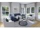 Sophisticated living room boasting modern furniture, plush seating, and abundant natural light for comfortable living at 118 Threaded Fern St, Summerville, SC 29485