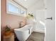 Serene bathroom featuring a freestanding tub, a separate glass shower, and stylish decor with natural light at 12 Poplar St, Charleston, SC 29403