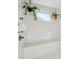 The bathroom features bright white subway tile, a window, and modern fixtures at 12 Poplar St, Charleston, SC 29403