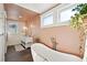 This bright and spacious bathroom features a soaking tub and double vanity at 12 Poplar St, Charleston, SC 29403