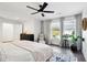Primary bedroom featuring hardwood floors, a ceiling fan, and lots of natural light at 12 Poplar St, Charleston, SC 29403