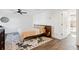 Bright bedroom features a ceiling fan, modern decor, light-colored linens, and ensuite bathroom at 12 Poplar St, Charleston, SC 29403