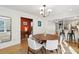Warm and inviting dining room with hardwood floors and an open transition to the kitchen at 12 Poplar St, Charleston, SC 29403