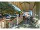 Inviting front porch featuring a ceiling fan and chairs, perfect for enjoying the neighborhood views at 12 Poplar St, Charleston, SC 29403
