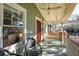 Inviting porch features a ceiling fan and swing for serene outdoor relaxation at 12 Poplar St, Charleston, SC 29403