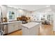 Charming kitchen boasts stainless steel appliances, tile backsplash and updated countertops at 12 Poplar St, Charleston, SC 29403