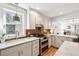 Modern kitchen featuring stainless steel appliances, tiled backsplash and updated countertops at 12 Poplar St, Charleston, SC 29403