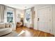 Cozy living room with natural light, hardwood floors and stylish decor near the front entrance at 12 Poplar St, Charleston, SC 29403