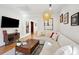 Cozy living room featuring hardwood floors, recessed lighting, and stylish decor and comfortable furniture at 12 Poplar St, Charleston, SC 29403