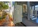 Outdoor shower with a wood privacy screen, set alongside a stone path, and a convenient shelf at 12 Poplar St, Charleston, SC 29403