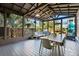 Covered patio with table, seating and view of backyard and playground at 12 Poplar St, Charleston, SC 29403