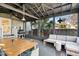 Enclosed patio with outdoor furniture, table, and grill at 12 Poplar St, Charleston, SC 29403