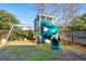 Backyard with a playground, including a slide and a swing at 12 Poplar St, Charleston, SC 29403