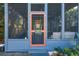 A beautiful screened porch with comfortable seating and view of greenery; a peaceful outdoor retreat at 12 Poplar St, Charleston, SC 29403