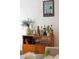 Bar cabinet with liquor bottles and drinking glasses at 12 Poplar St, Charleston, SC 29403