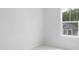 Minimalist bedroom with neutral carpet and a view of a neighboring home at 121 Moscato Ln, Summerville, SC 29485