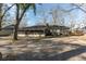 Backyard view of a brick home featuring a screened-in porch at 1239 Wappetaw Pl, Mount Pleasant, SC 29464