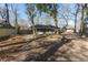 Large backyard space featuring a screened-in porch and mature trees at 1239 Wappetaw Pl, Mount Pleasant, SC 29464