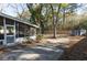 Backyard patio with screened-in porch and privacy fence at 1239 Wappetaw Pl, Mount Pleasant, SC 29464