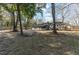Spacious backyard with storage shed, partial fencing, and mature trees at 1239 Wappetaw Pl, Mount Pleasant, SC 29464